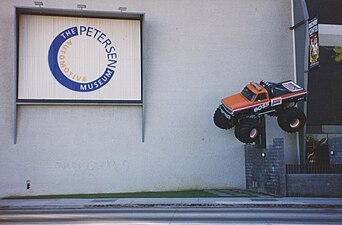 Classic Boss Ampm Monster Truck hanging from the wall, at museum display, before renovation