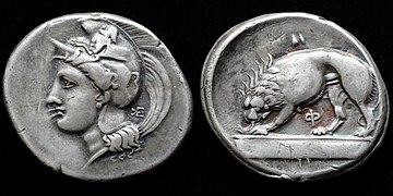 Silver stater struck in Velia 334-300 BCE depicting Athena wearing a Phrygian helmet decorated with a centaur and lion devouring prey