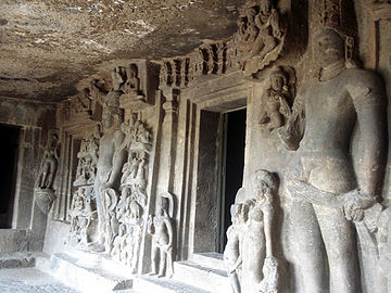 Various sculptors next to an entrance at Aurangabad Caves.