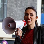 Ardern speaking into a megaphone