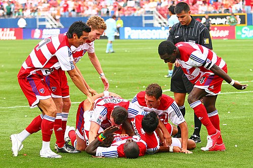 FC Dallas players congratulate Dominic Oduro after scoring the winning goal against the Colorado Rapids in 2007