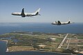 一架由海神整合测试小组操作的P-8A在派特森河海军航空站附近的空域，与P-3猎户座进行编队飞行。摄于2010年4月。