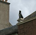 The "Girnin Dug" statue of a dog erected as a reproach to a neighbour suspected of poisoning the pet[34]