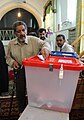 A man in Sarakhs put his vote to ballot, 2013 Iranian presidential election.