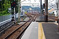 The view from the north end of platform 3/4, with the dual-gauge track from the J-TREC factory visible on the left, June 2010