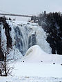 Photo of the Sugarloaf forming at the base of the falls in winter