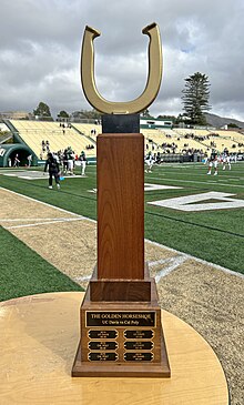The present-day Battle for the Golden Horseshoe trophy is shown in San Luis Obispo, California in 2023 before the annual college football rivalry game between Cal Poly and UC Davis.