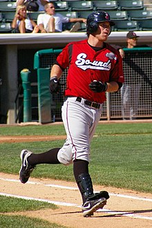 A baseball player in red and white