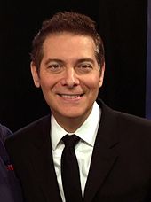 Headshot of a man wearing a formal suit.