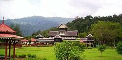 The iconic Istana Lama, with the Titiwangsa Mountains rising in the background