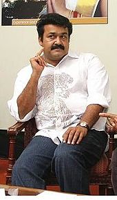 Mohanlal sitting in a chair