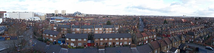 Regular rows of red brick houses stretching into the distance