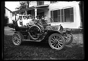 A family packed into a 1910 Mitchell