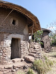 Tukul, two-story stone building