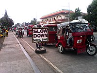 Row of parked tricycles outside the Santo Tomas Central Elem. School SPED Center campus.