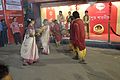 Two women dressed in garad sari are performing Dhunuchi dance at Lake View Road of Kolkata.