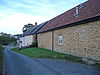 A series of houses along a lane.