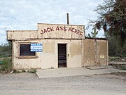 The Jack Ass Acres Service Station is an old abandoned 1930s gas station and convenience store located on the frontage road just off I-17 in New River, Arizona. The structure has been abandoned for years.