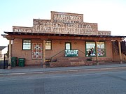 The Lorenzo Hubbell Trading Post and Warehouse was built in 1900 and is located at 523 W. Second Street. John Lorenzo Hubbell began building Navajo trading posts in Arizona and New Mexico in the late 1800s. He played an instrumental role in bridging the gap between the Caucasian (White) settlers and the Navajo people. It was listed in the National Register of Historic Places November 21 2002, Ref. #02001383.