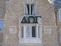 The Greek letters spelling "DOG", the symbol of the Hall