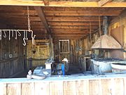 A 19th Century Blacksmith shop adjacent to the Audie Murphy Barn.