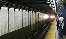 A "3" train arriving at the Borough Hall station of the Broadway-Seventh Avenue Line.