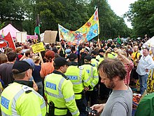 Protestors flanked by police march in Balcombe