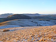 The rounded west ridge of Little Mell Fell, with Great Mell Fell beyond, and Blencathra and the Northern Fells in the distance