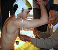 Image 5Upanayana samskara ceremony in progress. Typically, this ritual was for eight-year-olds in ancient India, but in the 1st millennium CE it became open to all ages. (from Samskara (rite of passage))