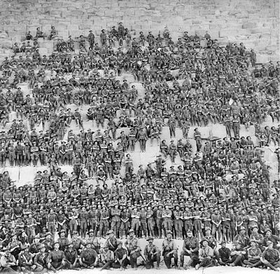 Soldiers of 11th Battalion posing on the Great Pyramid of Giza on 10 January 1915, prior to the landing at Gallipoli.
