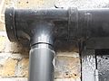 A collector with 112 mm gutter, draining into 68 mm downpipe