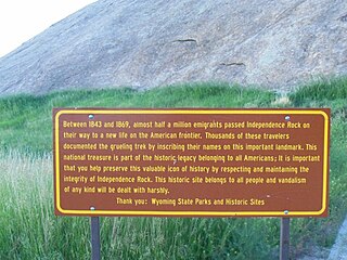 A sign in front of Independence Rock describing the history of site, taken in 2011.