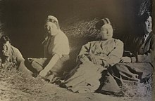 Jacques Raverat, Ka Cox, Gwen Raverat, Frances Cornford, as Neo-pagans, seated in a barn in Norfolk in 1912