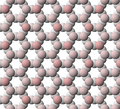 View of tetrahedral sheet structure of mica. The apical oxygen ions are tinted pink.