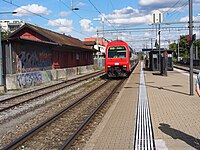 Platform and Re 450 class locomotive with double-deck carriages operating as S6 service