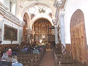 Inside the Mission San Xavier del Bac which was rebuilt 1783-1797 and is located at 1950 West San Xavier Rd.. Every wall is covered with paintings. The church was first built when Arizona belonged to Spain. Later Arizona became part of Mexico and finally a state of the United States of America. It is the oldest European structure in Arizona. It was listed in the National Register of Historic Places in 1966, ref.: #66000191.