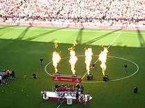 A coloured photograph of the Arsenal players celebrating their first Emirates Cup win.
