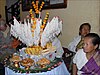 Laotian people around a festival tree with strings