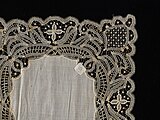 Lace doily by needleworker Barbett A. Hook with a pineapple pattern in the corner, 1894–1906[27]