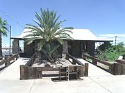 The House at 320 West Eighth Street a.k.a. The Stone Barber Shop was built in 1920 and is located at 320 W. 8th St. It was listed in the National Register of Historic Places in 2002, reference #02000745.