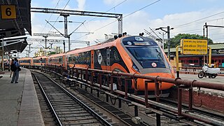 Mini Saffron-Grey Vande Bharat Express arriving from Mysuru Junction