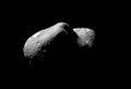 Eros, looking from one end of the asteroid across the gouge on its underside and toward the opposite end