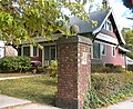 389 Norton Parkway at Goffe Terrace (1908), gate cottage with pier and tile beaver plaque.