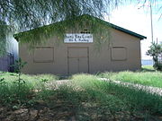 This historic building is the Santa Rita Center (also known as Santa Rita Hall). It is located at 1017 E. Hadley Street between 10th Street and 10th Place. It was here where Arizona native Cesar Chavez, the hero of farm workers, began his 24-day hunger strike on May 11, 1972, to draw attention to the inhumane conditions farm workers endured in the fields. Coretta King met with Chavez in the hall during his fast. For a while, the hall became the headquarters of what became the United Farm Workers of America Union. The structure, which was built in 1962, was listed in the Phoenix Historic Property Register on October 2007 (PHPR).