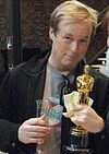 Brad Bird holding the Academy Award for Best Animated Feature