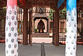 IAIA MoCNA columns flanking a sculpture by Bob Haozous (Chiricahua Apache)