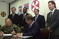 Image 11National Federation of Federal Employees officials sign a collective bargaining agreement with the U.S. 8th Army in October 2002.