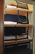 Beds in a sleeping car (with child's safety device)