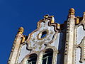 Detail from top of the building: bees and hives