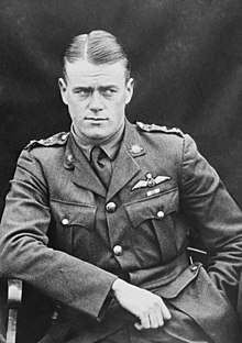 Half portrait of man in military uniform with pilot's wings on chest